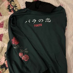 Green “Tokyo” rose sweater